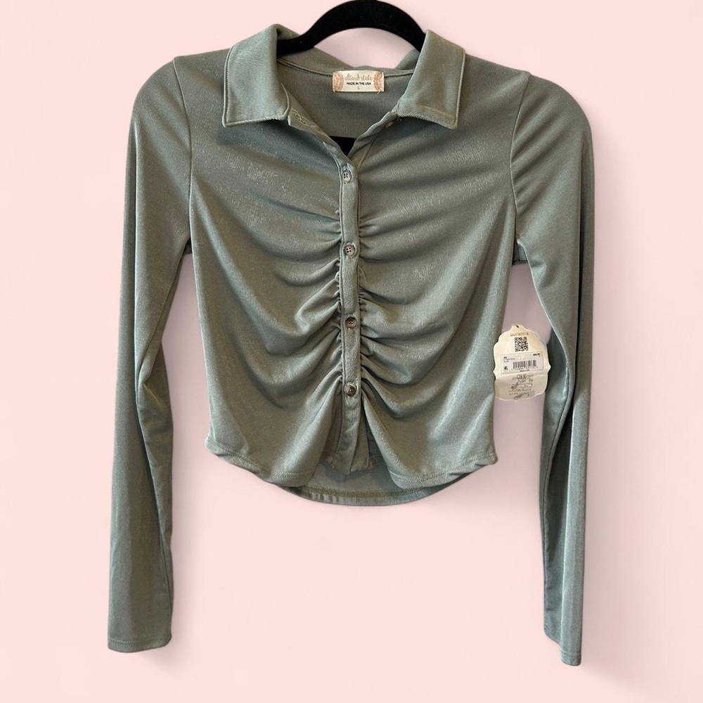 green cropped button up shirt